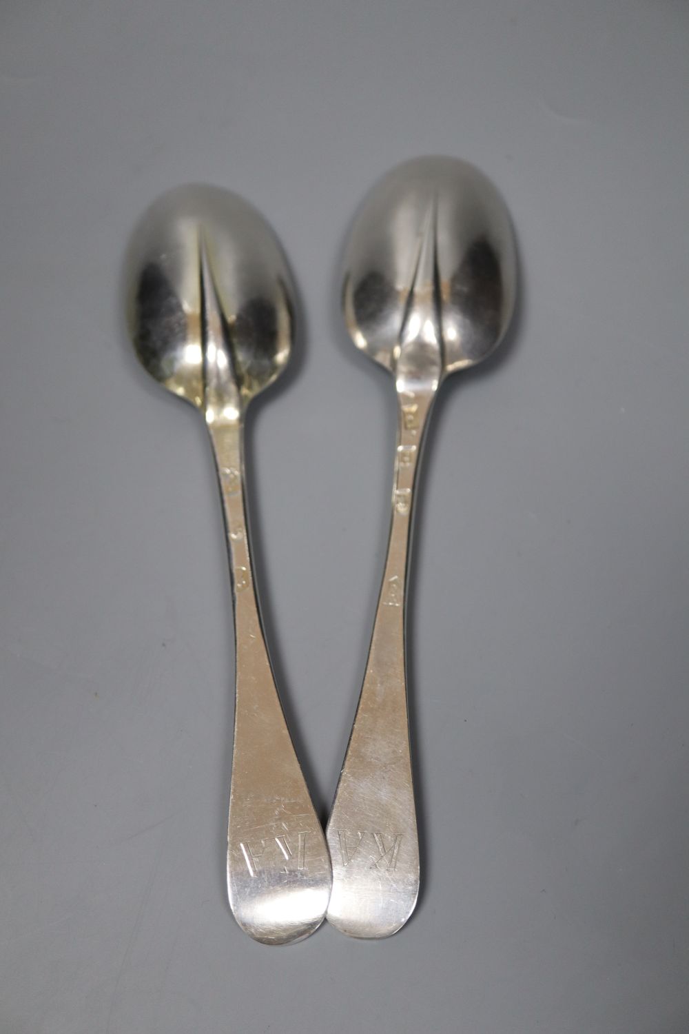 Two early 18th century silver Hanovarian rat tail pattern table spoons,